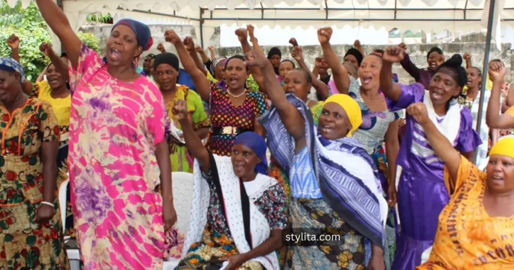 a group of motivated ladies raising hands to show their willingness towards volunteer activities