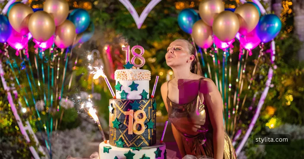 a beautiful girl celebrating her 18th birthday in a fully decorated area with a double story cake