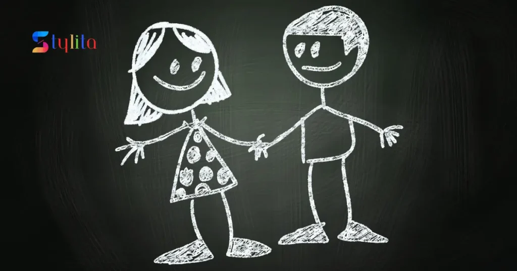 a chalk diagram on a blackboard of a boy and a girl hand in hand in happy mood