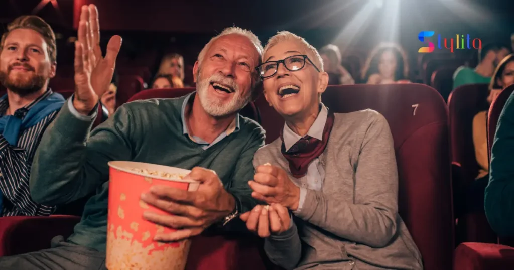 an old couple enjoying movie night in a cinema in a happy mood
