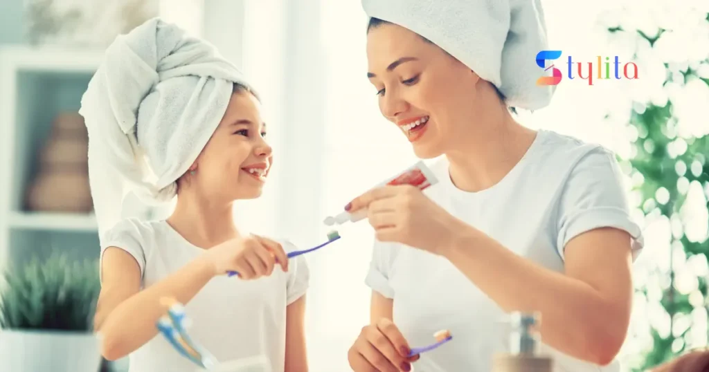 mother and daughter brushing teeth in a happy mood