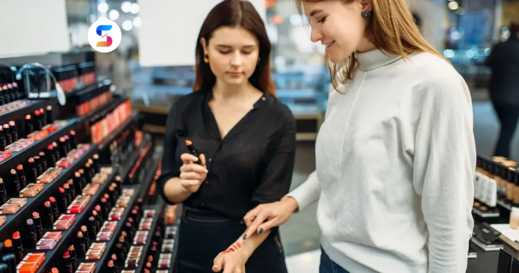 two girls choosing makeup in a makeup selling shop