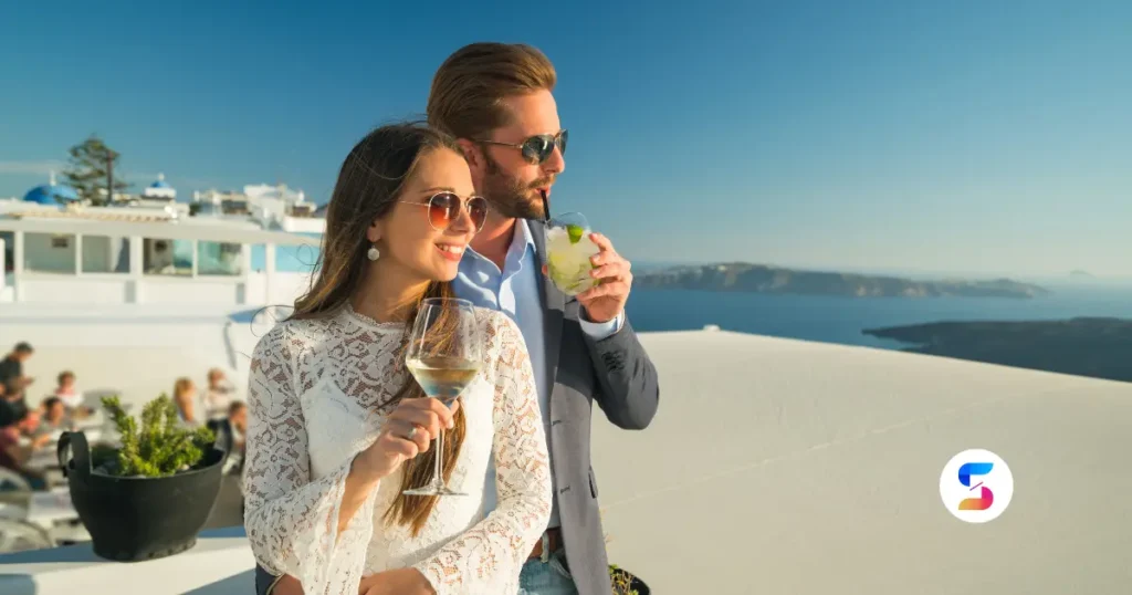 a beautiful and rich couple having their drinks on thier boat
