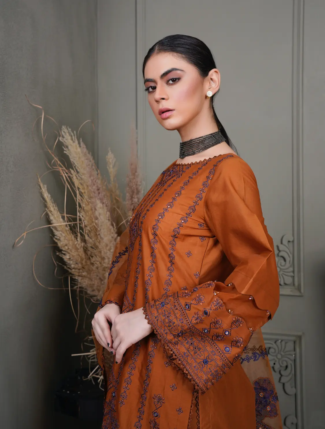 a stylish girl wearing an awesome brown dress